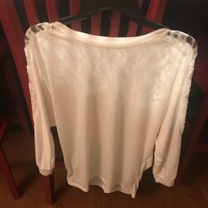 Lace back top. More a medium than large.